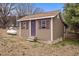 Charming outbuilding featuring matching siding, shutters, and a separate entrance at 1723 Bahama Rd, Bahama, NC 27503