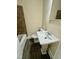 Bathroom featuring bathtub, toilet and pedestal sink at 1723 Lynne Ave, Henderson, NC 27536