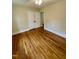 Bedroom featuring refinished wood flooring and neutral paint at 1723 Lynne Ave, Henderson, NC 27536