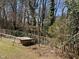 The spacious backyard features a wooden fence and small animal enclosure at 1816 Phillips Dr, Sanford, NC 27330