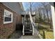 Stairway leads to private deck, enhancing outdoor living and providing access to backyard with privacy fence at 1816 Phillips Dr, Sanford, NC 27330