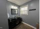 Bathroom featuring black vanity, slate tile floors and nice lighting at 1816 Phillips Dr, Sanford, NC 27330