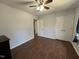 Bedroom with neutral paint, ceiling fan, and hardwood floors at 1816 Phillips Dr, Sanford, NC 27330