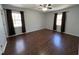 Bright and airy bedroom with hardwood floors, neutral walls, and ample natural light at 1816 Phillips Dr, Sanford, NC 27330