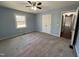 Carpeted bedroom with neutral walls, ceiling fan, closet, and natural light at 1816 Phillips Dr, Sanford, NC 27330