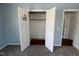 Bedroom closet with bi-fold doors and upper shelving at 1816 Phillips Dr, Sanford, NC 27330