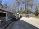 Concrete driveway, shed and wooded backyard are perfect for extra storage at 1816 Phillips Dr, Sanford, NC 27330
