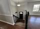 Inviting entryway with stairs, newel post and front door welcomes you home at 1816 Phillips Dr, Sanford, NC 27330