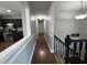 Hallway view highlighting the home's layout, connecting kitchen, staircase, and living areas at 1816 Phillips Dr, Sanford, NC 27330