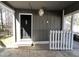 Covered patio leading to backyard through a picket fence, offering a private and shaded outdoor space at 1816 Phillips Dr, Sanford, NC 27330