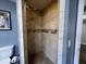 Neutral tiled shower with upgraded fixtures in bathroom at 1816 Phillips Dr, Sanford, NC 27330