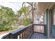 Inviting balcony with railing, offering a peaceful outdoor space with tree-lined street views at 1900 Sunset Ave, Durham, NC 27705