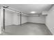 Unfinished basement space provides potential for customization and storage with white cinder block walls and concrete flooring at 1900 Sunset Ave, Durham, NC 27705