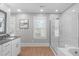 Clean bathroom with glass shower, soaking tub, and modern fixtures at 1900 Sunset Ave, Durham, NC 27705