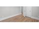 This bedroom features hardwood floors, neutral paint and white trim at 1900 Sunset Ave, Durham, NC 27705