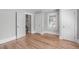 Inviting bedroom featuring hardwood floors, neutral paint, and multiple doors, offering a cozy retreat at 1900 Sunset Ave, Durham, NC 27705