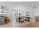 Elegant dining area with hardwood floors, sophisticated lighting, and kitchen access at 1900 Sunset Ave, Durham, NC 27705