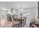 Open-concept dining area featuring stylish chandelier, hardwood floors, and views of the kitchen at 1900 Sunset Ave, Durham, NC 27705
