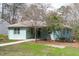 Beautifully landscaped property showcasing a well-maintained home with mature trees and greenery at 1900 Sunset Ave, Durham, NC 27705