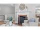 Close up of a fireplace with a decorative facade and classic design elements at 1900 Sunset Ave, Durham, NC 27705