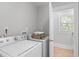 Functional laundry room featuring a washer, dryer, and ample storage at 1900 Sunset Ave, Durham, NC 27705