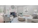 Bright living room showcasing a decorative fireplace, stylish furniture, and natural light at 1900 Sunset Ave, Durham, NC 27705