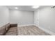 Bright living room with a modern light fixture and vinyl flooring at 1900 Sunset Ave, Durham, NC 27705