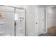Bathroom featuring a glass door shower with a convenient shampoo alcove at 20 Granite Falls Way, Youngsville, NC 27596
