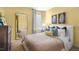 Bright bedroom with a full-length mirror, comfortable bed, and tasteful decor at 20 Granite Falls Way, Youngsville, NC 27596