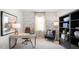 Inviting home office with stylish decor, desk, chair, bookshelf, and natural light from the window at 20 Granite Falls Way, Youngsville, NC 27596