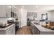 Spacious kitchen with stainless steel appliances, granite countertops, and ample cabinet space at 20 Granite Falls Way, Youngsville, NC 27596