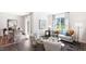 Open concept living and dining area with stylish furnishings and ample natural light at 20 Granite Falls Way, Youngsville, NC 27596