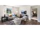 Comfortable living room with stylish furniture, a large window, and modern decor at 20 Granite Falls Way, Youngsville, NC 27596