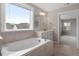 Bathroom showcasing a soaking tub, tiled floor, and single sink vanity at 2005 Ernesto Ln, Raleigh, NC 27603
