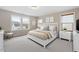 Tastefully decorated bedroom featuring large windows, sitting area, and carpet at 2005 Ernesto Ln, Raleigh, NC 27603