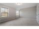 Bright, spacious bedroom with neutral walls, carpet flooring, and large windows at 2005 Ernesto Ln, Raleigh, NC 27603