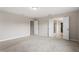 Spacious bedroom with neutral walls and carpet and doors to the Primary bath at 2005 Ernesto Ln, Raleigh, NC 27603