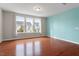 Bright bedroom with large windows and hardwood floors overlooking community at 2005 Ernesto Ln, Raleigh, NC 27603