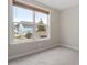 Bedroom with large window for natural light and neutral-colored carpet at 2005 Ernesto Ln, Raleigh, NC 27603