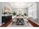 Dining room featuring modern table, stylish decor, hardwood floors and natural lighting at 2005 Ernesto Ln, Raleigh, NC 27603