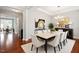 Formal dining room with chandelier, hardwood floors, and designer decor at 2005 Ernesto Ln, Raleigh, NC 27603