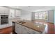 Spacious kitchen island with granite countertop and stainless steel sink at 2005 Ernesto Ln, Raleigh, NC 27603