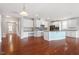 Open concept kitchen with stainless steel appliances, blue island, granite counters and hardwood floors at 2005 Ernesto Ln, Raleigh, NC 27603