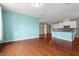 Open living space with hardwood floors, flowing into modern kitchen at 2005 Ernesto Ln, Raleigh, NC 27603