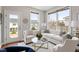 Cozy living room features large windows and stylish white furniture at 2005 Ernesto Ln, Raleigh, NC 27603