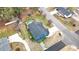 Aerial view showing in-ground pool, deck, large backyard, driveway, and surrounding neighborhood at 206 Hamby St, Clayton, NC 27520