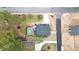 Stunning aerial view of a home with a backyard pool, wooden deck, lush landscaping and a dark grey roof at 206 Hamby St, Clayton, NC 27520