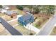 Aerial view of two-story home with in-ground pool, deck, driveway, and landscaping at 206 Hamby St, Clayton, NC 27520