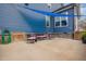 Backyard featuring a patio with outdoor seating and a blue shade sail, perfect for relaxing and entertaining guests at 206 Hamby St, Clayton, NC 27520