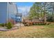 Spacious backyard with a wooden deck featuring a gated entrance, perfect for outdoor entertaining at 206 Hamby St, Clayton, NC 27520